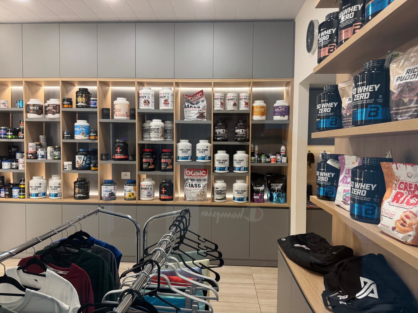 The Magic Store at Gymmagic with supplement shelves and apparel racks